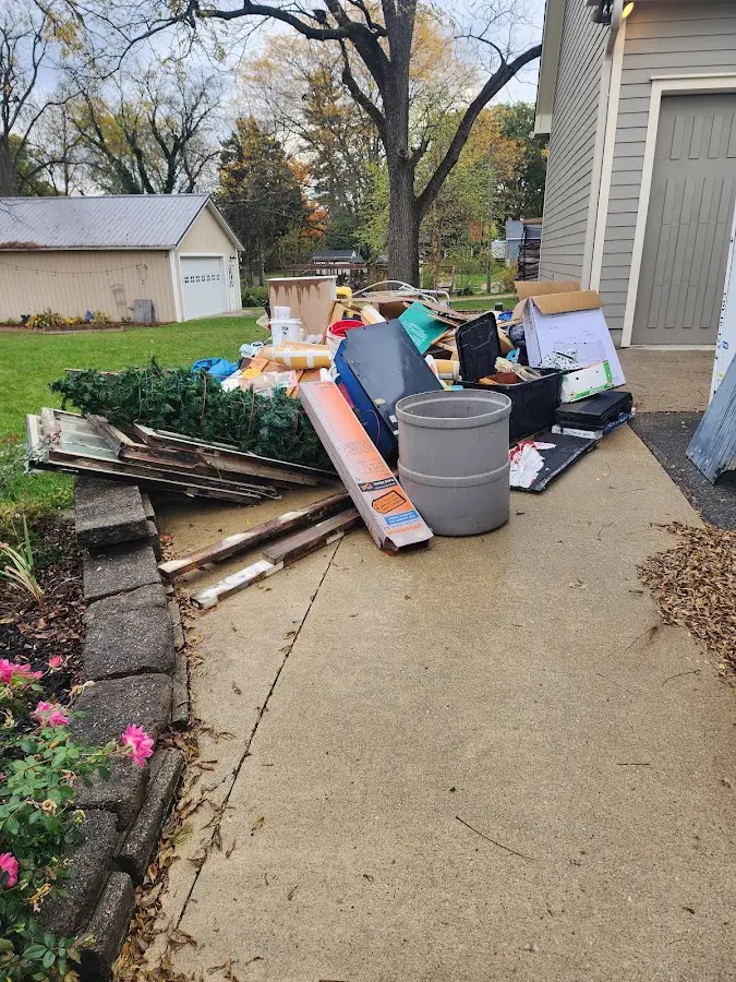 Dumpster being loaded with debris for 10 Yard Dumpster Rental in Boscawen